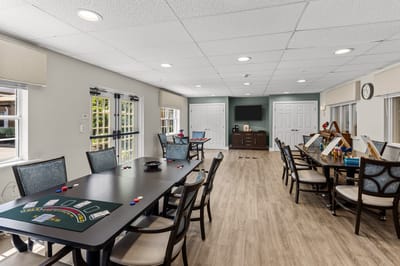 Interior activity room with tables and games