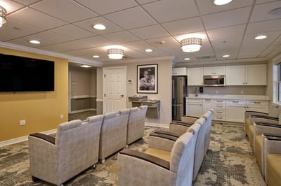 Interior lounge area with seating and kitchenette