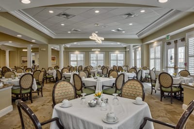 Elegant dining room setup with tables and chairs