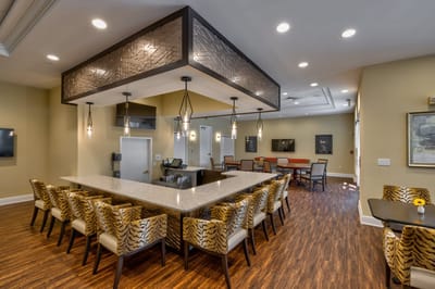 Bright common area with modern furnishings and lighting