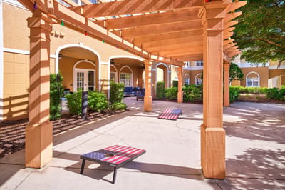 Outdoor seating area with pergola and benches