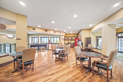 Bright common area with tables and chairs