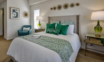 Well-decorated resident room with a cozy bed