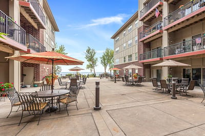 Outdoor patio area with seating and umbrellas