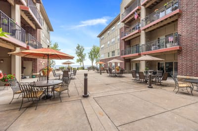 Outdoor patio area with seating and umbrellas