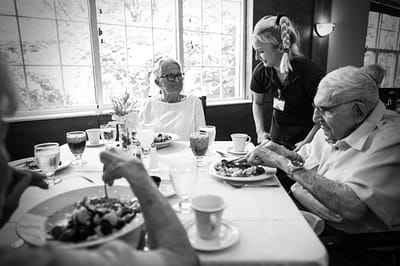Residents enjoying a meal in the dining room
