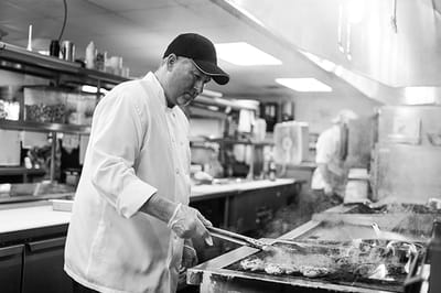 Chef preparing food in a facility kitchen