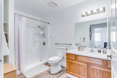 Bright bathroom with modern fixtures and lighting