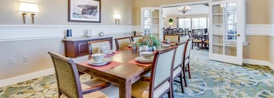 Dining room setting with a table set for a meal