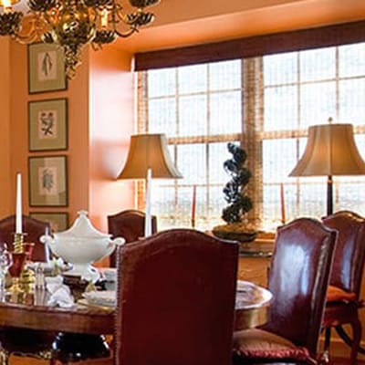 Elegant dining room with a round table and decorative lamps