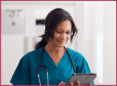Avery Heights Assisted Living and Memory Care, independent living in Hartford, CT — Nurse using a tablet in a healthcare setting