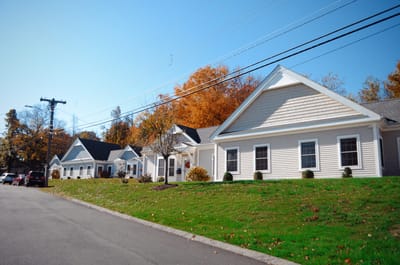 Exterior view of a senior living facility on a sunny day