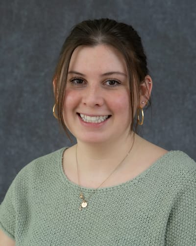 Avery Heights Assisted Living and Memory Care, independent living in Hartford, CT — Portrait of a smiling young woman with earrings