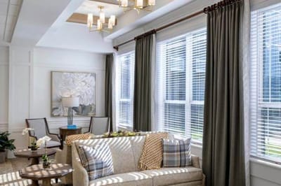 Bright common area with comfortable seating and large windows