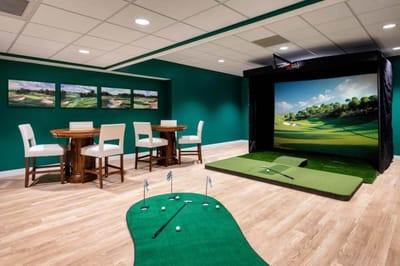 Indoor golf simulation area with putting green