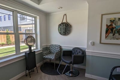 Cozy corner with chairs and wall clock