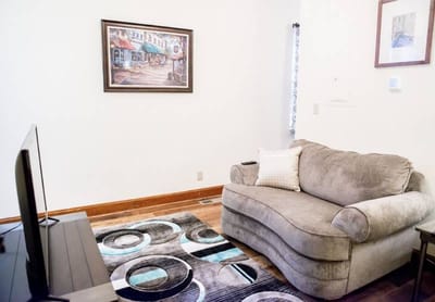 Cozy living room with a couch and artwork