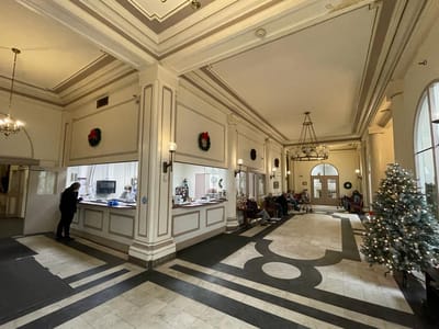 Interior lobby area with holiday decorations and residents
