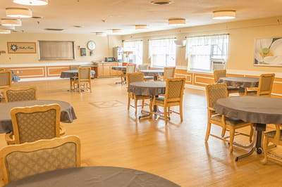 Interior view of a clean dining room with tables
