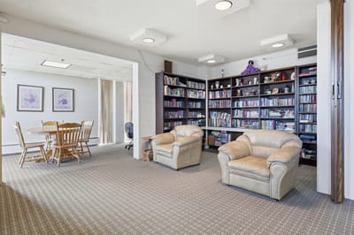 Common area with bookshelves and seating