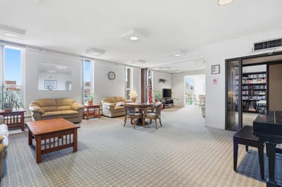 Bright common area with seating and bookshelves