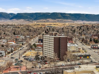 Aerial view of Skyline Towers building with mountains in background