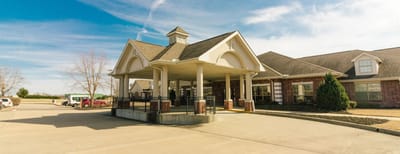 Edgewood Health and Rehabilitation, Nursing Home in Springdale, AR — Entrance of a senior living facility with a portico