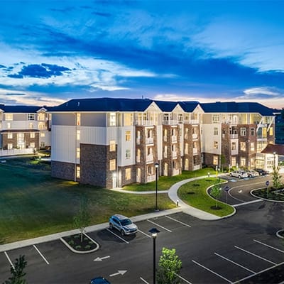 Aerial view of a senior living facility at dusk
