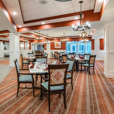 Elegant dining room with tables set for meals