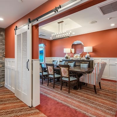 Brightly decorated dining room with tables and chairs