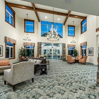 Bright and inviting lobby area with seating and decorations