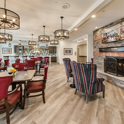 Bright common area with comfortable seating and a fireplace