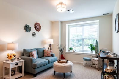 Cozy resident room with seating and plants