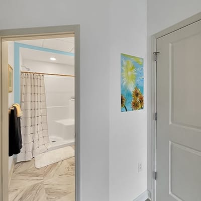 View of a bathroom with colorful artwork