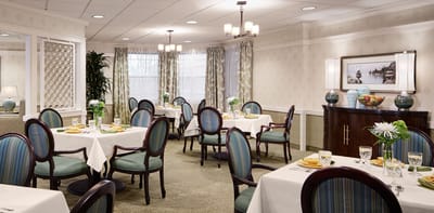 Elegant dining room setup with tables and chairs