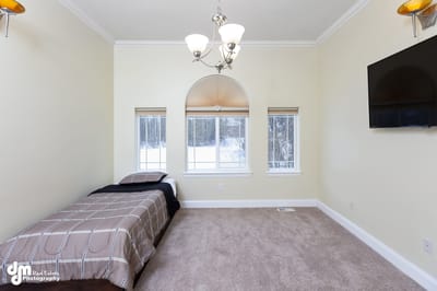Bright, furnished resident room with a window