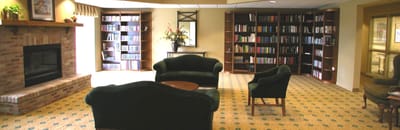 Cozy library with comfortable seating and bookshelves