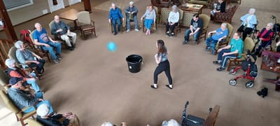 Residents participating in an indoor group activity
