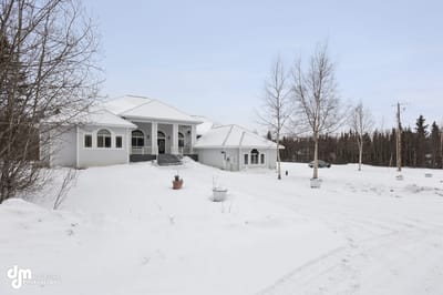 Exterior view of a large assisted living facility in winter