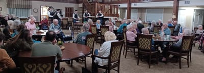 Residents enjoying a live performance in the common area