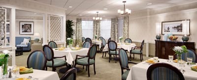 Bright dining room with tables set for a meal