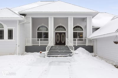 Exterior view of a senior living facility covered in snow