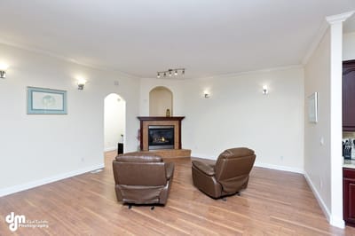 Cozy living area with two armchairs and a fireplace