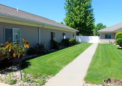 Well-maintained garden path between residential buildings
