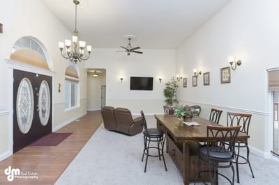 Bright common area with seating and dining table