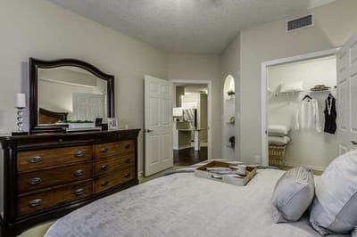 Cozy bedroom with a dresser and closet