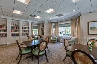 Bright common area with bookshelves and seating