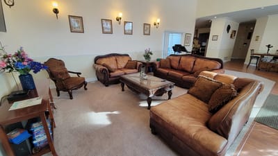 Cozy common area with leather furniture and decorations