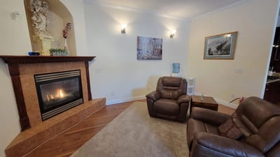 Cozy interior lounge with a fireplace and seating
