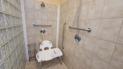 Accessible bathroom with safety features and shower chair